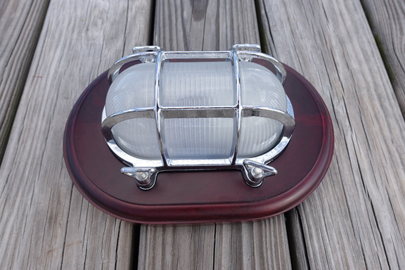 chrome nautical decor light with wooden trim plate