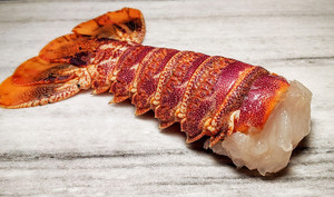 Pictured is a single uncooked Tristan Lobster Tail