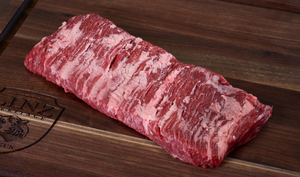 Pictured is an uncooked whole Linz Heritage Angus reserve skirt steak on a cutting board.