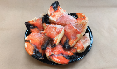 Pictured is a plate of Jonah Crab Cocktail Claws