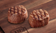 two cooked Petite Tenderloin Filets Linz Heritage Angus Reserve on cutting board