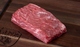 Pictured is an uncooked Bavette Steak Linz Heritage Angus Reserve on cutting board