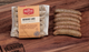 Pictured is 1 pack of Chef Martin Breakfast links with some fully cooked links to the side on a table.