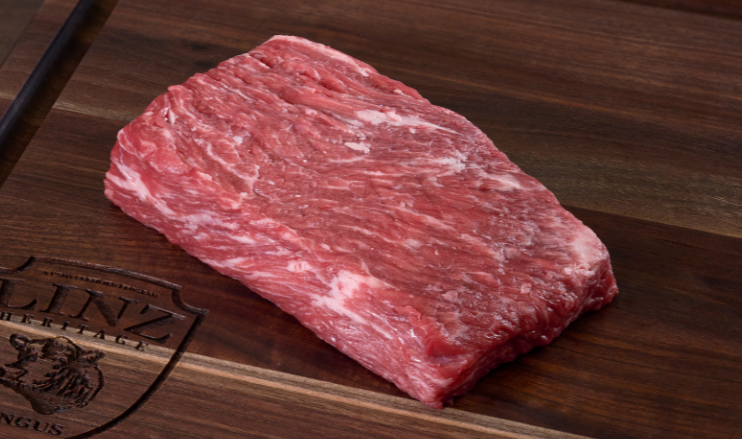 Pictured is an uncooked Bavette Steak Linz Heritage Angus Reserve on cutting board
