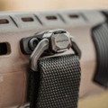 Elevate your tactical setup with the Magpul QDM Quick Disconnect Sling Mount, a robust and innovative upgrade for your standard push-button quick detach sling swivels.