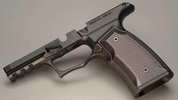 Sharps Bros grip module for the Sig P365 XMacro. G2 model includes steel lug insert.  

Machined from billet 7075-T6 Aluminum.  Mil-Spec black anodized finish.  Black anodized aluminum grip panels.