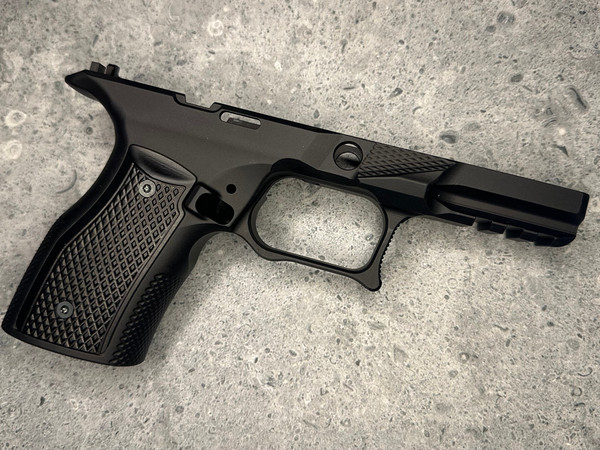 Sharps Bros Springfield Echelon Compact aluminum grip module with black anodized finish and textured panels.