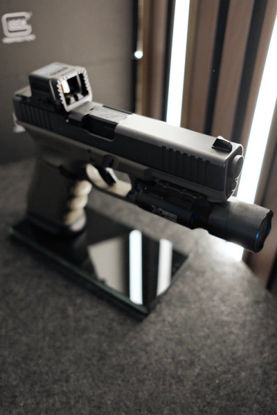 Custom Glock 17 Gen 3 MOS OD Green with Holosun EPS, Radian Guardian, ZEV barrel, SureFire X300 Ultra, factory case, and accessories.