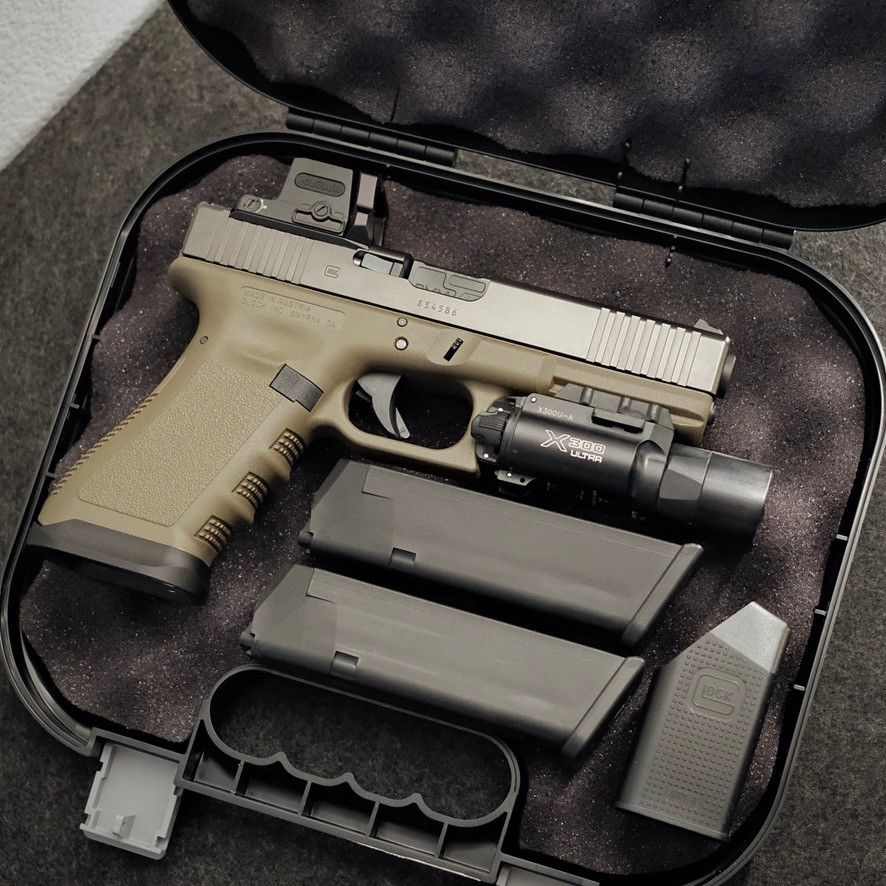 Custom Glock 17 Gen 3 MOS OD Green with Holosun EPS, Radian Guardian, ZEV barrel, SureFire X300 Ultra, factory case, and accessories.