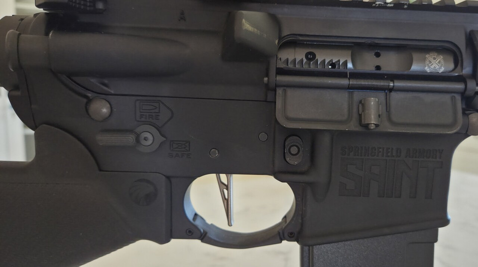 Used Springfield Armory SAINT AR-15 in 5.56 NATO with a California featureless setup, upgraded trigger, M-LOK handguard, and QD-ready stock.