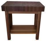 A professional-grade chopping table from HLC Furniture featuring an exceptionally thick butcher block prep surface, square-cut architectural legs, and an integrated lower storage shelf.