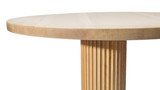 Close up of modern maple table atop an elegant, fluted wood pedestal. Soft shadows accent the delicate curving lines of this custom designed furniture.