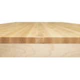 A macro focus on the table edge, displaying the premium 1.25-inch thick maple edge grain top as it transitions into the visually light, milled 0.75-inch refined perimeter profile.