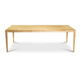 A full profile view along the long side of the modern maple Parsons table, highlighting the expansive 84.5-inch dining surface, refined edge profile, and open ADA-compliant seating clearance.