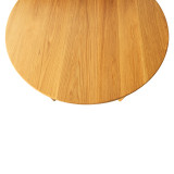 Top-down view of the Cascade Round Dining Table showing round solid wood tabletop, natural grain, and refined circular shape