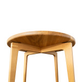 Underside view of the Cascade Round Dining Table highlighting cascading apron curves, sculpted leg detail, and solid wood construction