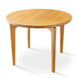 Cascade Round Dining Table in solid hardwood with sculpted legs, round tabletop, softened edge, and handcrafted joinery