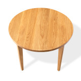Front overhead view of the Cascade Round Dining Table with round hardwood top, softened edge, and elegantly sculpted solid wood legs