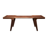 Low front view of minimalist solid walnut coffee table with clean modern silhouette, inset floating top, and angled legs