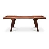 Low front view of minimalist solid walnut coffee table with clean modern silhouette, inset floating top, and angled legs