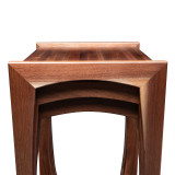 Tight straight view of walnut nesting tables showing stacked design, butcher block tops, and clean modern lines