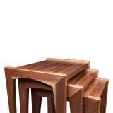 Modern walnut nesting tables partially open with three solid wood tables designed to nest together or function independently