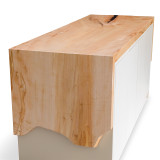 Side detail of Rift Credenza showing waterfall maple slab flowing over the end panel with natural live edge and organic wood character