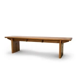 Solid white oak keyhole bench at a three-quarter angle showing the seat length, slab legs, and under-seat supports