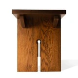 End view of the white oak keyhole bench leg showing the full keyhole cutout and the two angled seat brackets above