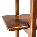 Detailed view of a shelf joint on the handcrafted Modern Walnut Ladder Bookcase, displaying the high-quality craftsmanship and smooth edges.