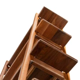 Low-angle view looking up at the top shelves of the solid wood Modern Walnut Ladder Bookcase, highlighting its contemporary ladder-style frame.
