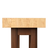 Close-up detail of the chopping table's short side, emphasizing the clean architectural lines where the end grain hickory meets the solid walnut base.