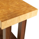 Detailed angled close-up of the commercial work table's corner, highlighting the flush, handcrafted joinery between the thick hickory block and walnut frame.