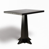 Low angle view of HLC Furniture Monument pedestal dining table showing tapered laminated column and four-foot base