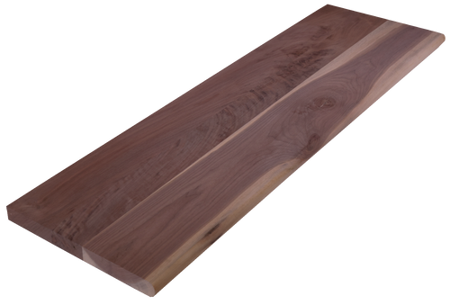 Angled shot of a solid Character Walnut hardwood stair tread. The unfinished tread has a bullnose edge and no returns.