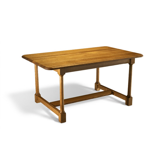 White Oak Farmhouse Dining Table with rift and quarter sawn top, rounded edges, turned tapered legs, and curved lower stretcher