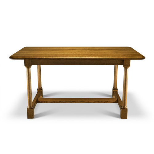 Long side view of White Oak Farmhouse Dining Table with traditional turned legs, solid oak cross members, and warm farmhouse finish