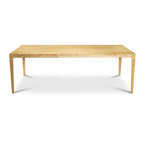 A full profile view along the long side of the modern maple Parsons table, highlighting the expansive 84.5-inch dining surface, refined edge profile, and open ADA-compliant seating clearance.