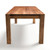 Short-side view of Signature Parsons Dining Table with solid hardwood construction, square Parsons legs, and modern architectural silhouette