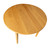 Overhead view of the Cascade Round Dining Table showing natural hardwood grain, round top, and clean modern silhouette