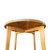 Underside view of the Cascade Round Dining Table highlighting cascading apron curves, sculpted leg detail, and solid wood construction