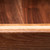 Close-up detail of solid walnut coffee table grain with maple accent layer and handcrafted laminated wood construction