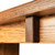Close-up of the square block detail beneath the seat of the white oak keyhole bench, showing oak grain and joinery