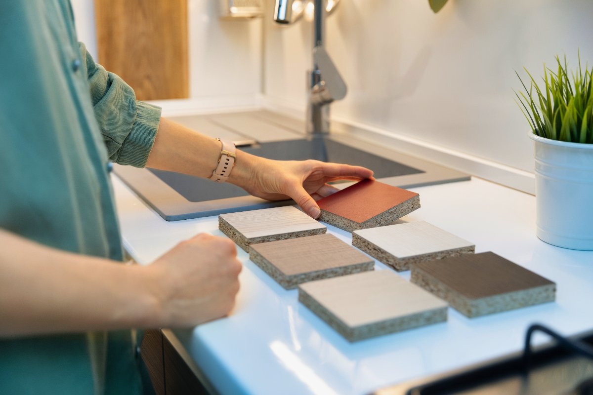 Woman Choosing Between Countertop Options 