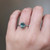 S810-ZOE-WG-NVST2325 - Ring on Hand