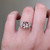 S823-FLEUR-WG-NVST3747 - Ring on Hand