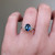 S823-FLEUR-WG-NVST3732 - Ring on Hand