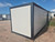 BasePod 10™ modular unit with white exterior and black framing, staged on-site in Townsville with multiple units in view. BasePod 10™ modular unit with white exterior and black framing, staged on-site in Townsville with multiple units in view.
