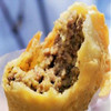 Mrs Wheat's Mild Meat Pies 48ct 3.75oz, close-up of a partially bitten meat pie showing savory meat filling inside a flaky, golden pastry
