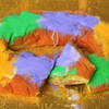 Gambino's Praline King Cake with icing on side, colorful Mardi Gras-themed dessert with purple, green, yellow, and orange icing on a gold decorative plate.